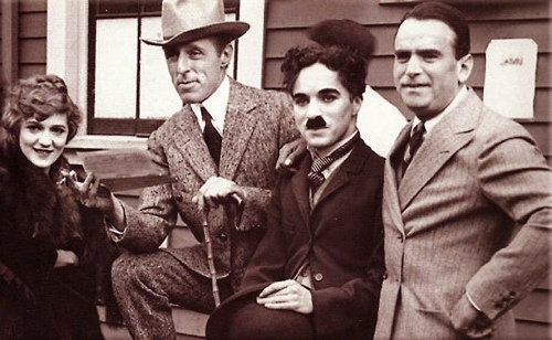 Charlie Chaplin Joins With Pickford, Fairbanks and Griffith to Form United Artists<br>  <br />(Film Daily, 1939)